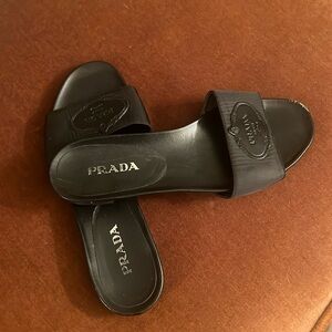 Prada slides! So comfortable and so chic! Slightly worn but in very good shape
